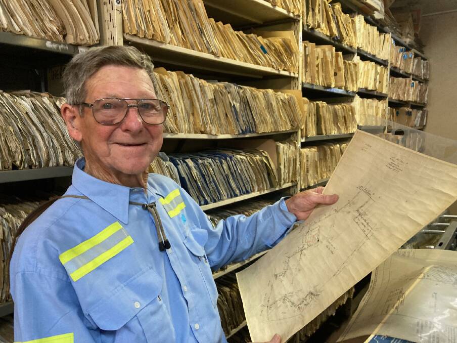 Newcastle surveyor John McNaughton amid his vast store of work files and maps at his office. Picture: Mike Scanlon. Below: The NBN TV studios being built pre-1962 in Mosbri Crescent. It's now being demolished for a residential development. Picture: NBN TV archives
