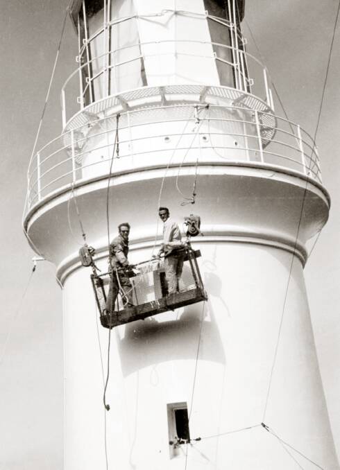 ONLY IN FINE WEATHER: Painting the lighthouse tower at scenic Maatsuyker Island, off Tasmania, was a risky but necessary task.