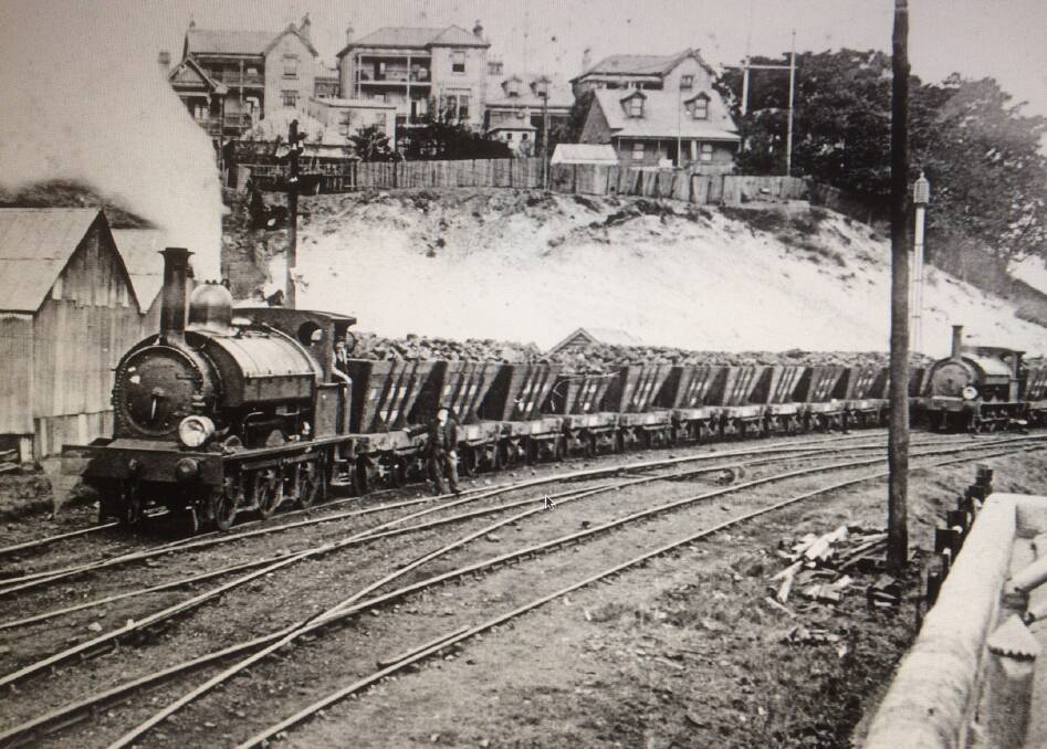 Route: Steam engines with wagons below Church Street homes wait to cross over Hunter Street. Pictures: Supplied
