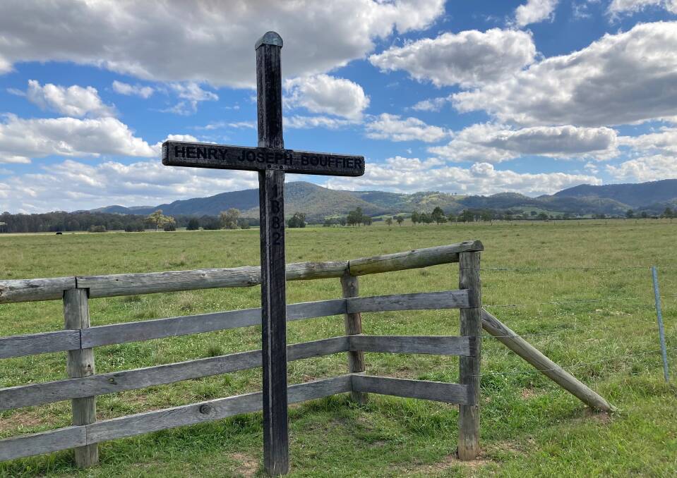 LANDMARK: This roadside wooden cross at Pokolbin salutes an unknown Hunter wine pioneer. Pictures: Mike Scanlon