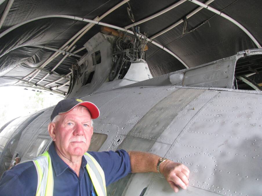 Long haul: Volunteer coordinator Terry Woolard with the Kilaben Bay aircraft. 