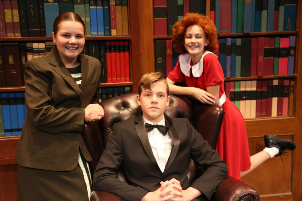 ANNIE KIDS: High Street Productions’ Carissa Herd (as Grace Farrell), Jay Scott (Oliver Warbucks) and Eliza Durie (Annie). Photo: Belle Holiday-Williams