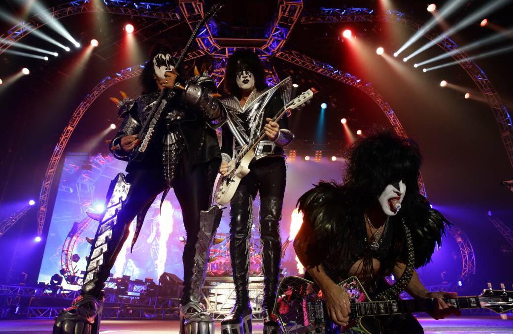 GOD IT HURTS: Easy on the knees there Paul. Kiss, performing in Newcastle in 2015.
Photo: Jonathan Carroll