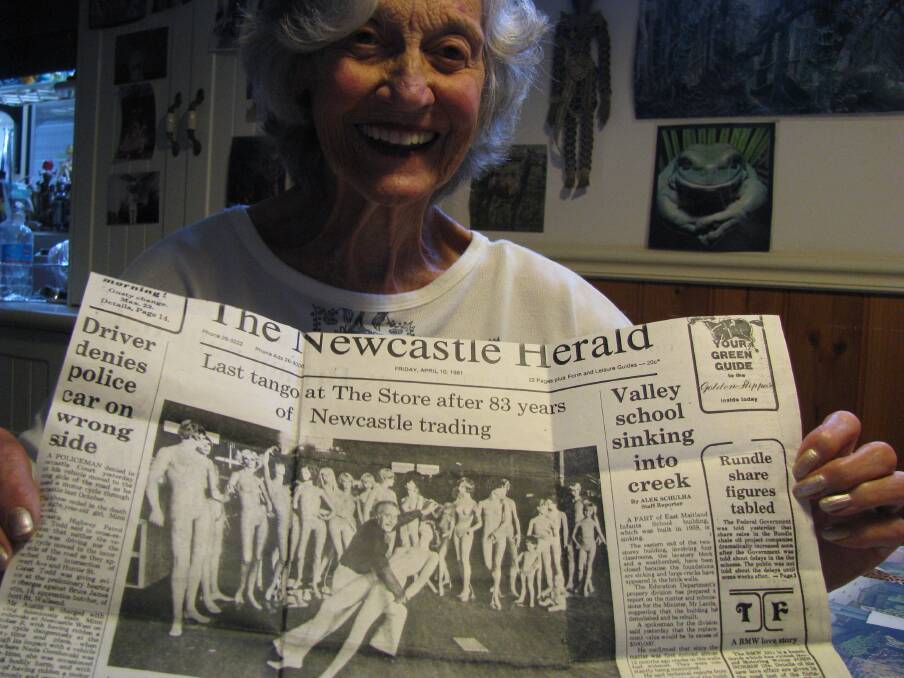 Last waltz: Redhead’s Julie Lomax with a 1981 Herald front page recording the closure of the iconic Store building in Hunter St. Photo: Mike Scanlon
