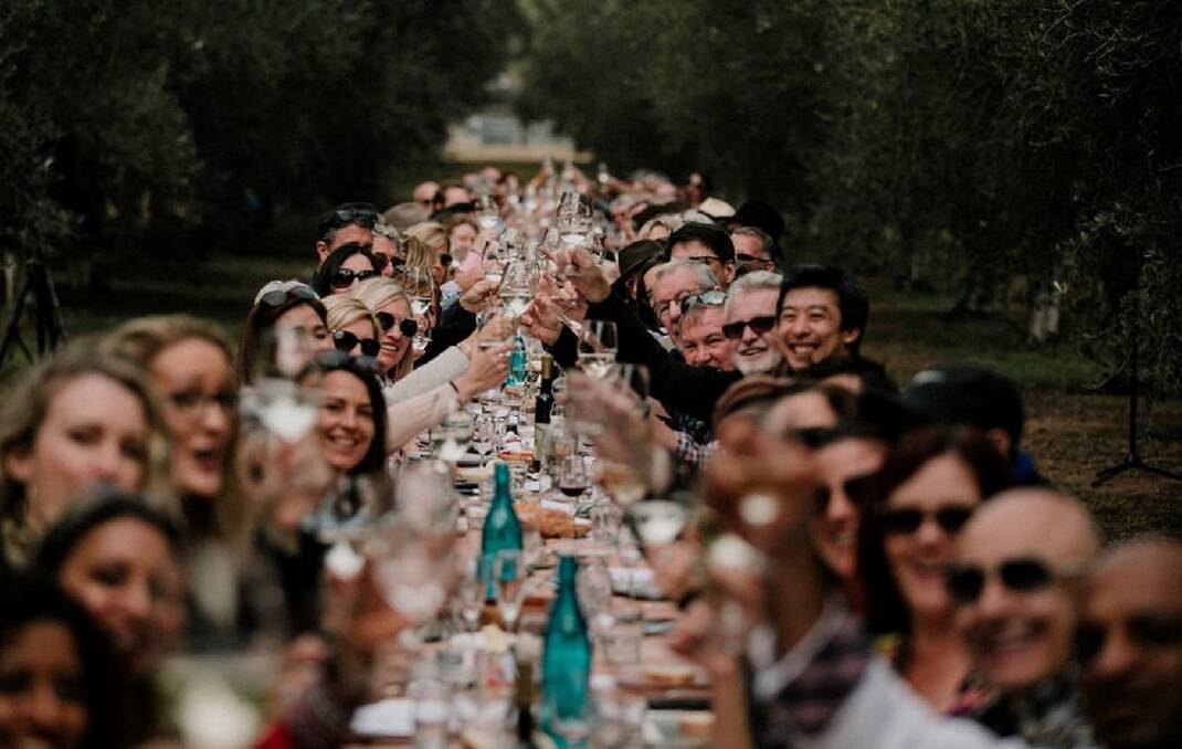 LONG STRETCH: Guests enjoy the 2019 Olive Long Table lunch at Whispering Brook vineyard at Broke.