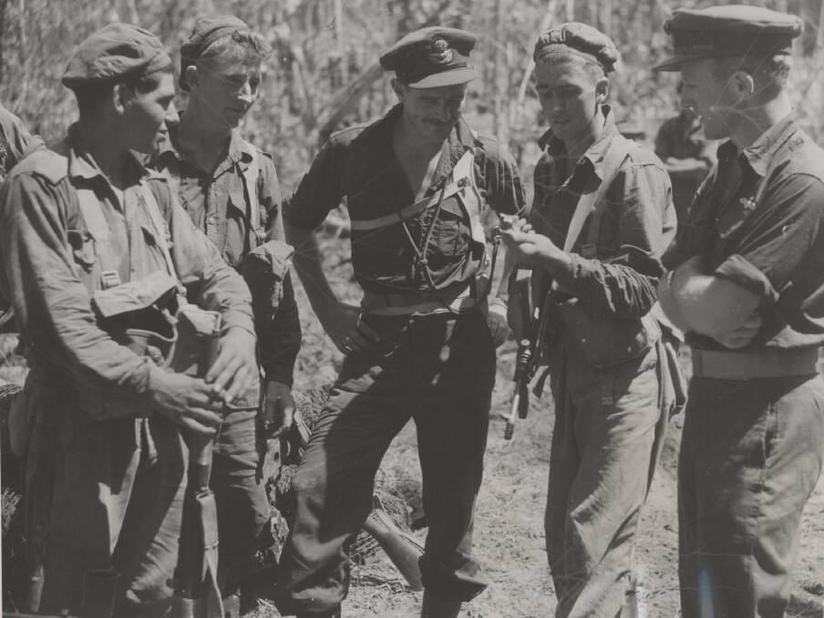 SUCCESS: Royal New Zealand Air Force pilots talking with Australian infantrymen in northern New Guinea. Image: University of Newcastle's Cultural Collections