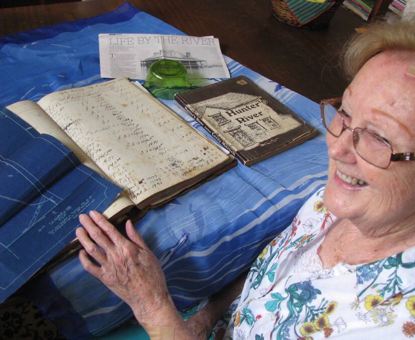 Sleuth: Patricia Robertson with Hannell family memorabilia, including a 1907 accounts ledger and a family vault blueprint. 