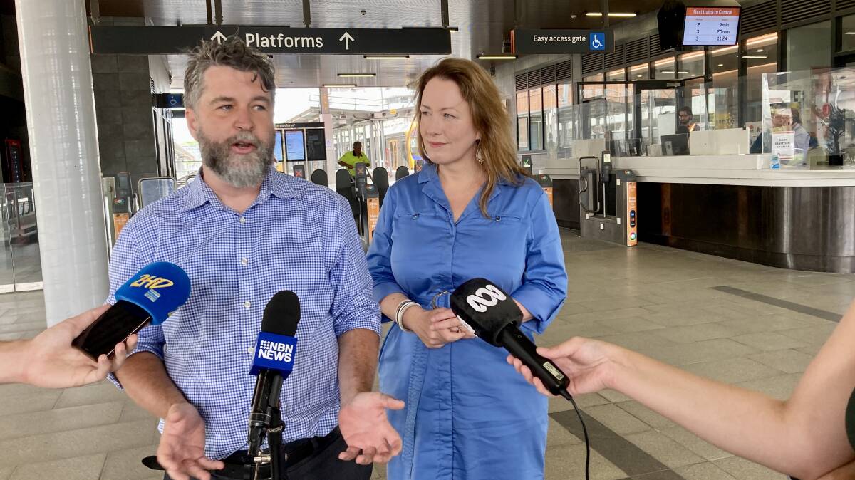 Greens state election candidate and councillor John Mackenzie with MP Abigail Boyd at Newcastle interchange on Thursday. 