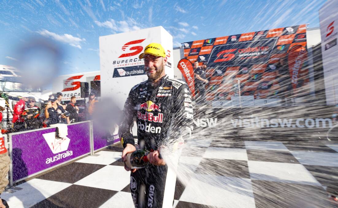 Shane van Gisbergen pops the champagne after Saturday's race. Picture: Mark Horsburgh