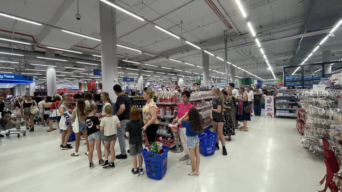 Shoppers lined up at the Kmart checkout at Westfield Kotara on Saturday morning. 