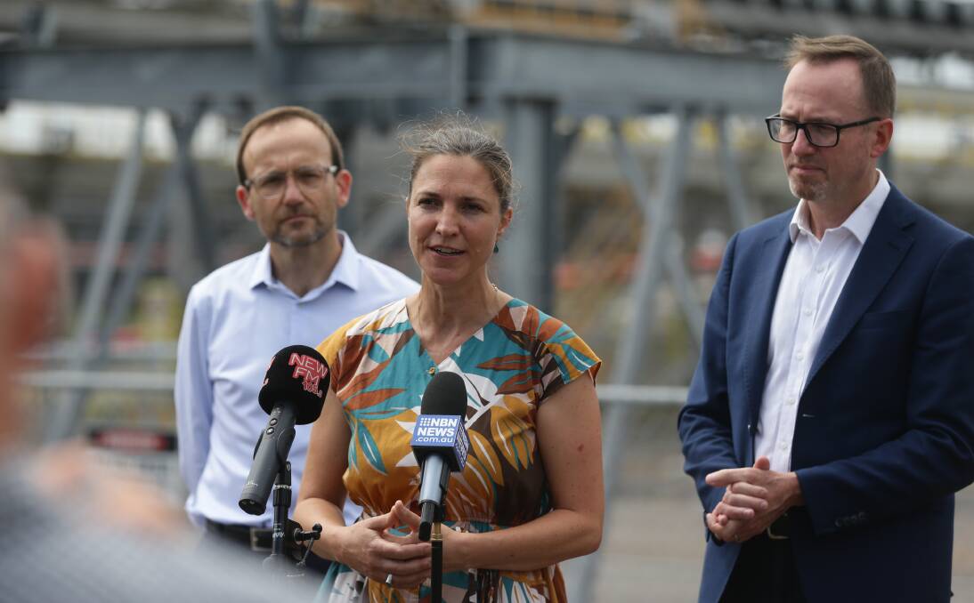 CAMPAIGN LAUNCH: Charlotte McCabe with Greens leader Adam Bandt and Dave Shoebridge at Kooragang Island on Friday. Picture: Jonathan Carroll
