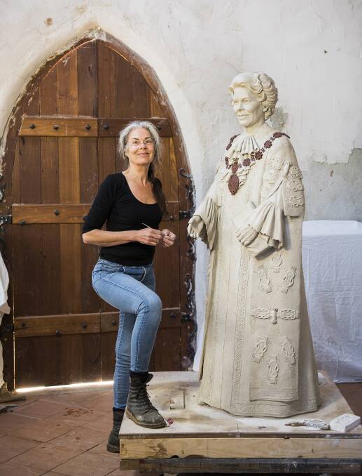 TRIBUTE: Sculptor Margot Stephens with the clay mold of her Joy Cummings statue. Picture: Amber Hooper