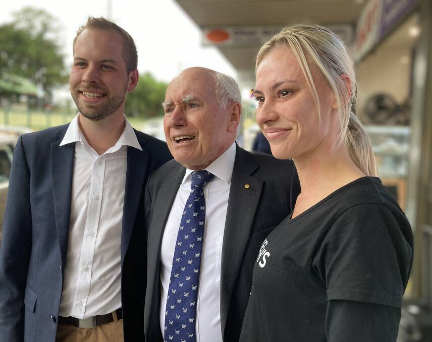 MEET AND GREET: John Howard with Hunter candidate James Thomson and voter Kristy Hayward at Morisset.