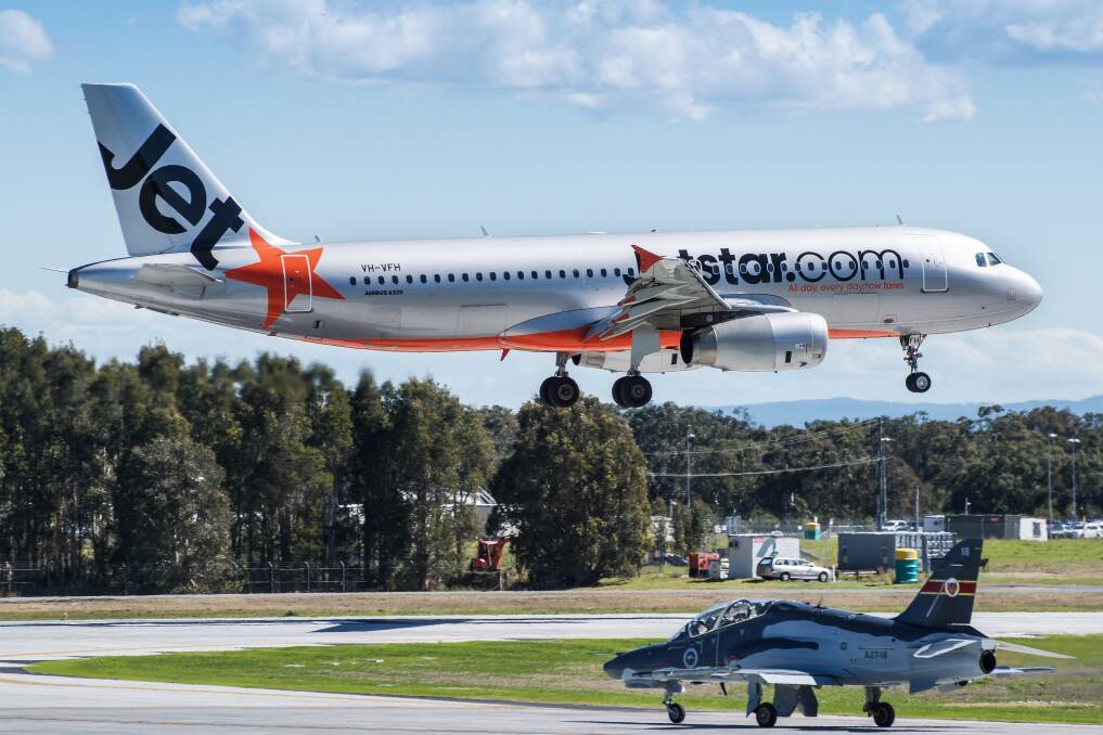 A Jetstar plane taking off from Newcastle Airport.