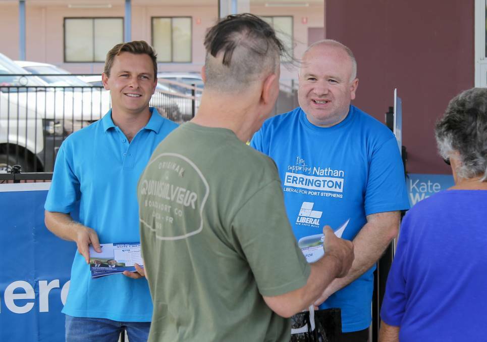 Liberal Nathan Errington, right, on pre-poll with Taylor Martin in Port Stephens. Picture by Ellie-Marie Watts