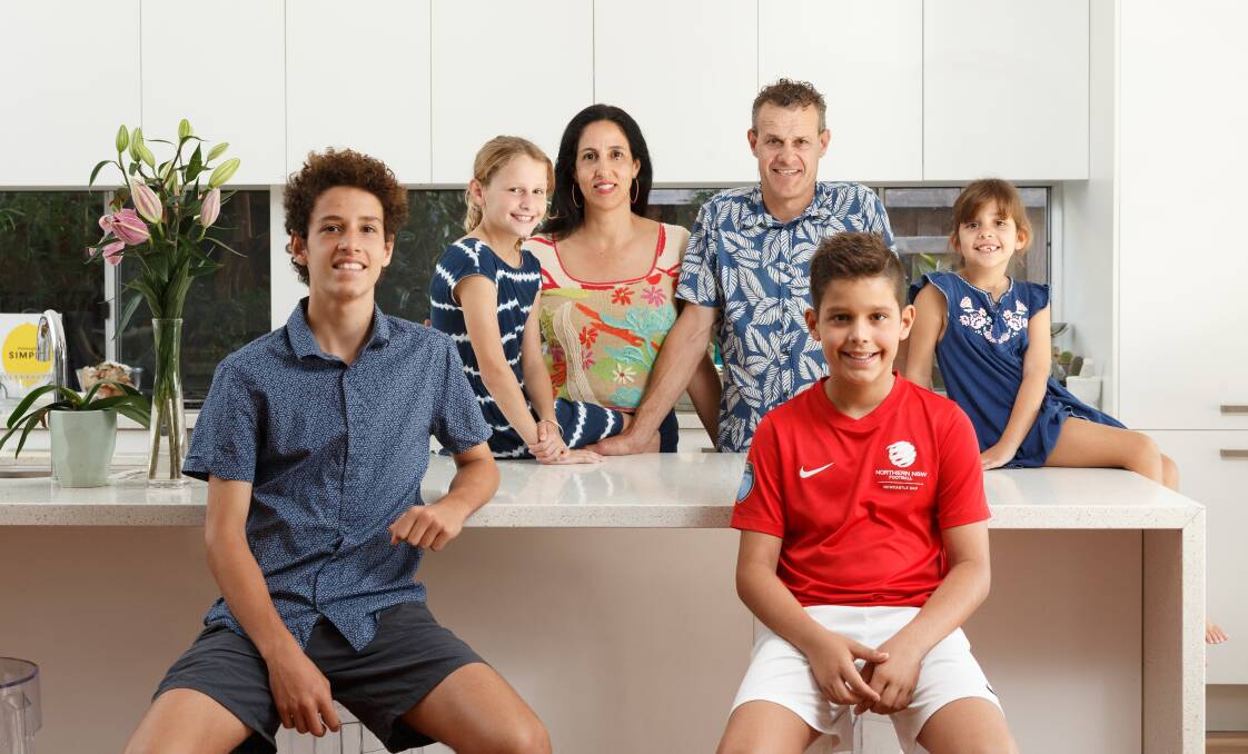 Tim Crakanthorp at home in Hamilton South on Sunday with wife Lara and children Oscar, 14, Sienna, 10, Luca, 11, and Avalon, 6. Picture: Max Mason-Hubers