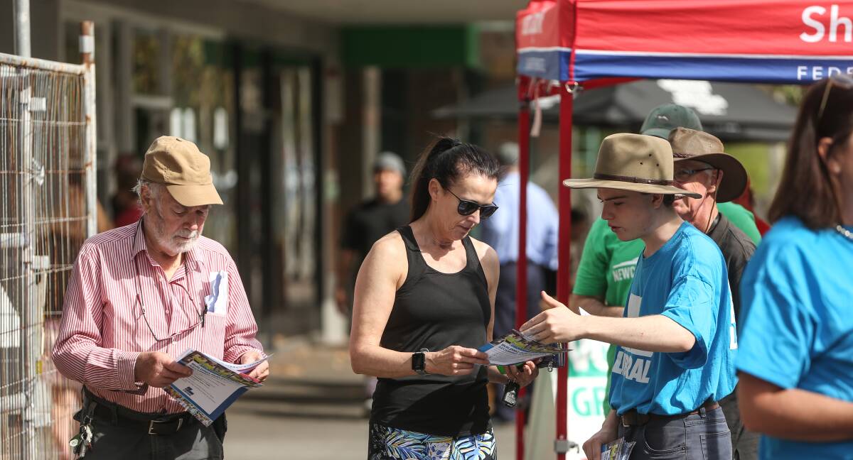 DECISION TIME: Voters at a pre-poll booth in King Street, Newcastle. An estimated 25 per cent of Australians cast their vote before today. 