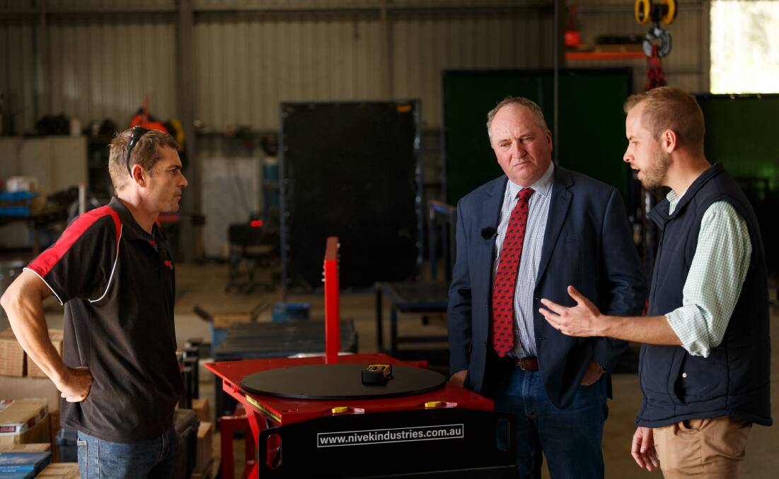 VISIT: Barnaby Joyce and James Thomson talk to Kevin Cant at Nivek Industries in Singleton on Wednesday. Picture: Max Mason-Hubers