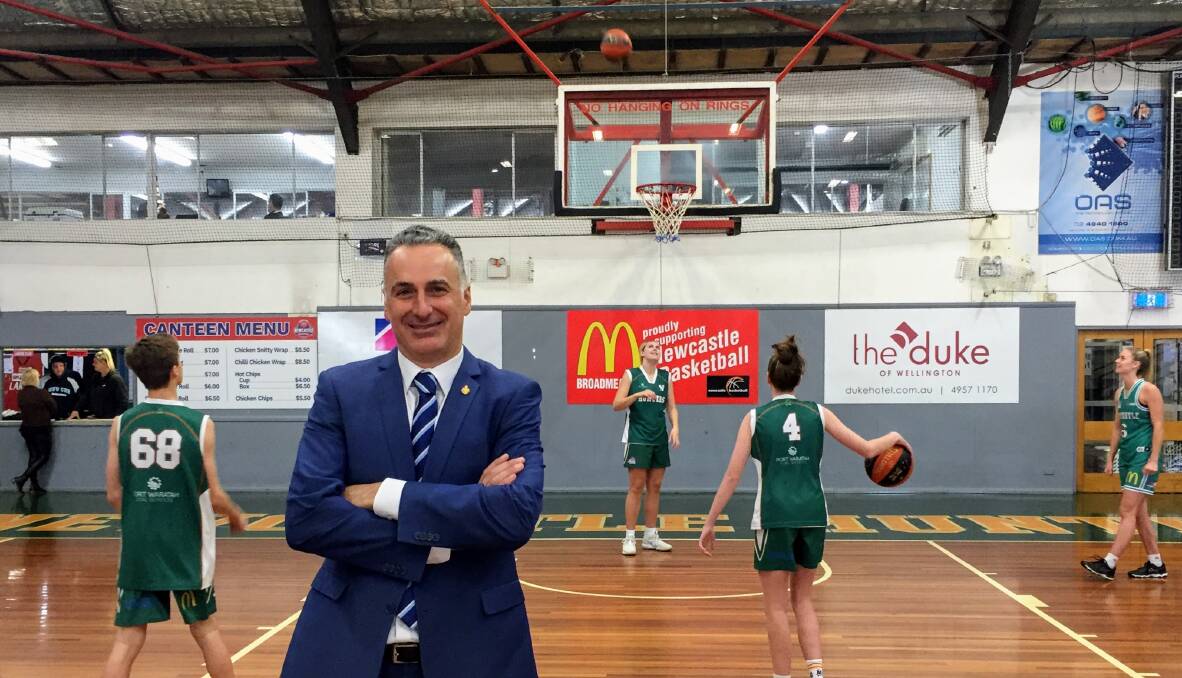 ON THE MONEY: NSW Sports Minister John Sidoti at Broadmeadow basketball stadium on Thursday with Newcastle Hunters players. 