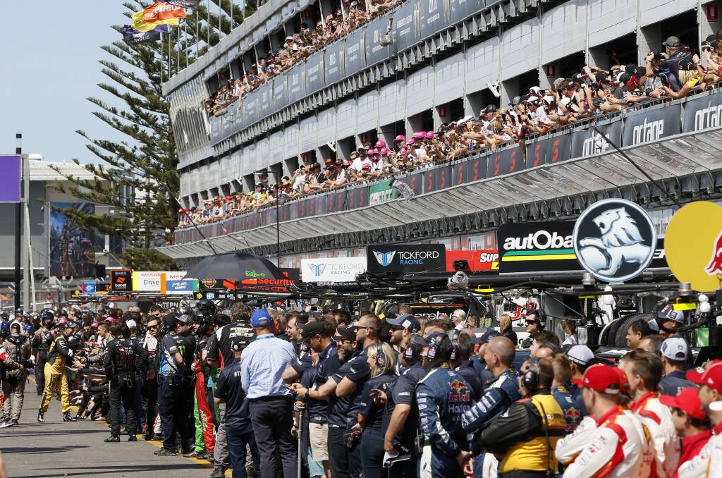 Craig Lowndes, far left, says farewell in pit straight.