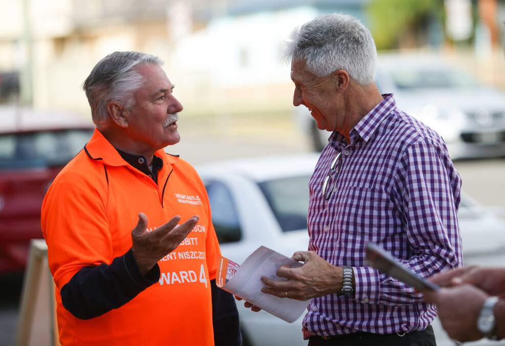 ONCE BITTEN, TWICE SHY: Mike Rabbitt talks to a voter at Wallsend on polling day in 2017. Picture: Jonathan Carroll