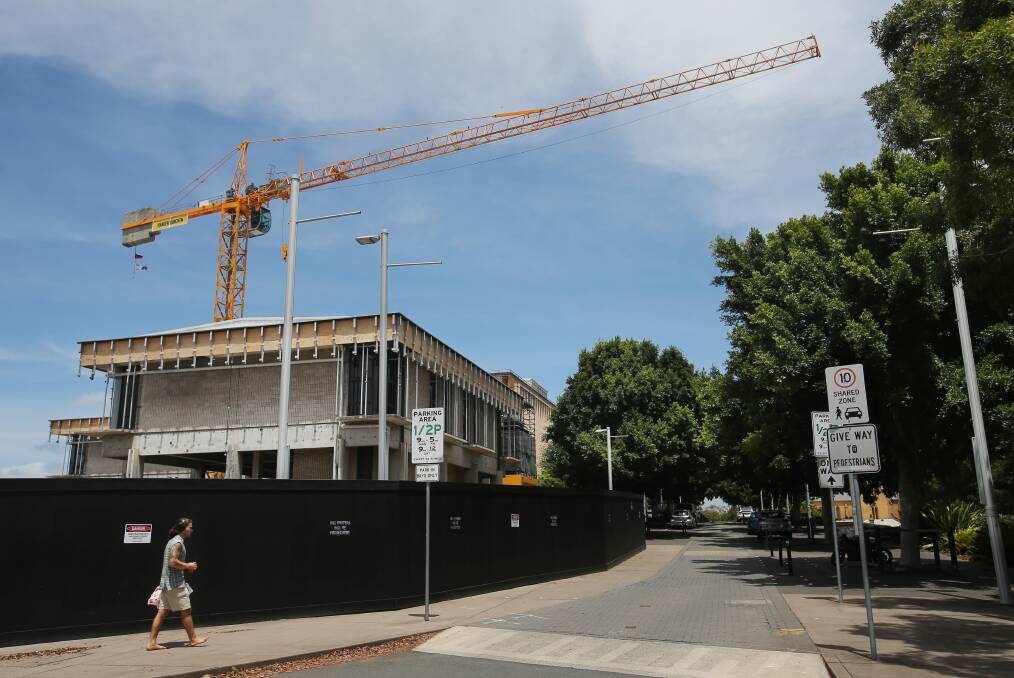 A crane looms over the Newcastle Art Gallery construction site on Friday. Picture by Simone De Peak