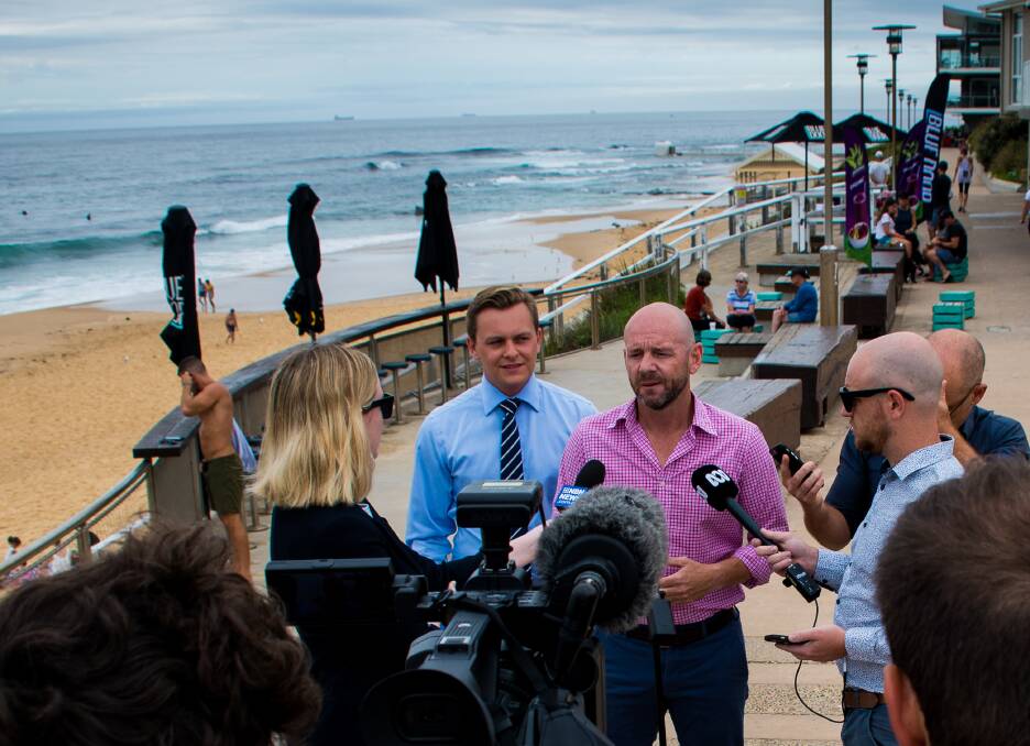 NET VALUE: Primary Industries Minister Niall Blair announcing the trial of drum lines at Merewether on Monday. Picture: Simon McCarthy