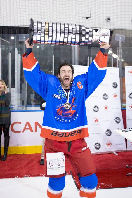Rob Starke lifts the Goodall Cup after leading Newcastle to the 2015 AIHL title.