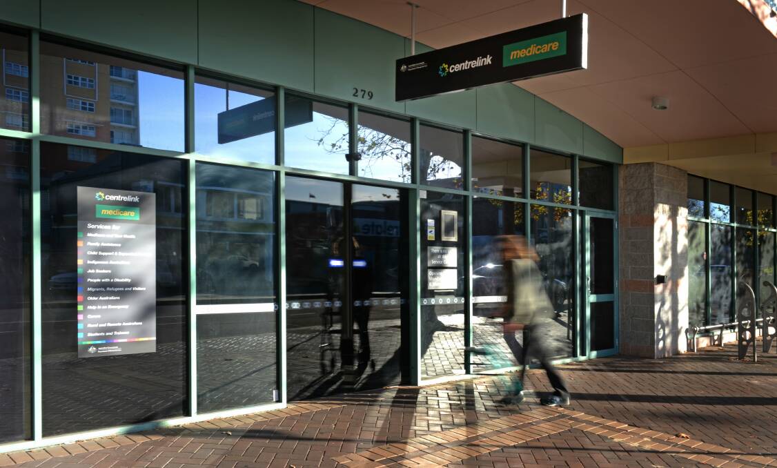 ON THE MOVE: A customer enters the Newcastle Centrelink office in King Street. The Department of Human Services plans to shift its Newcastle staff into one building. Picture: Marina Neil