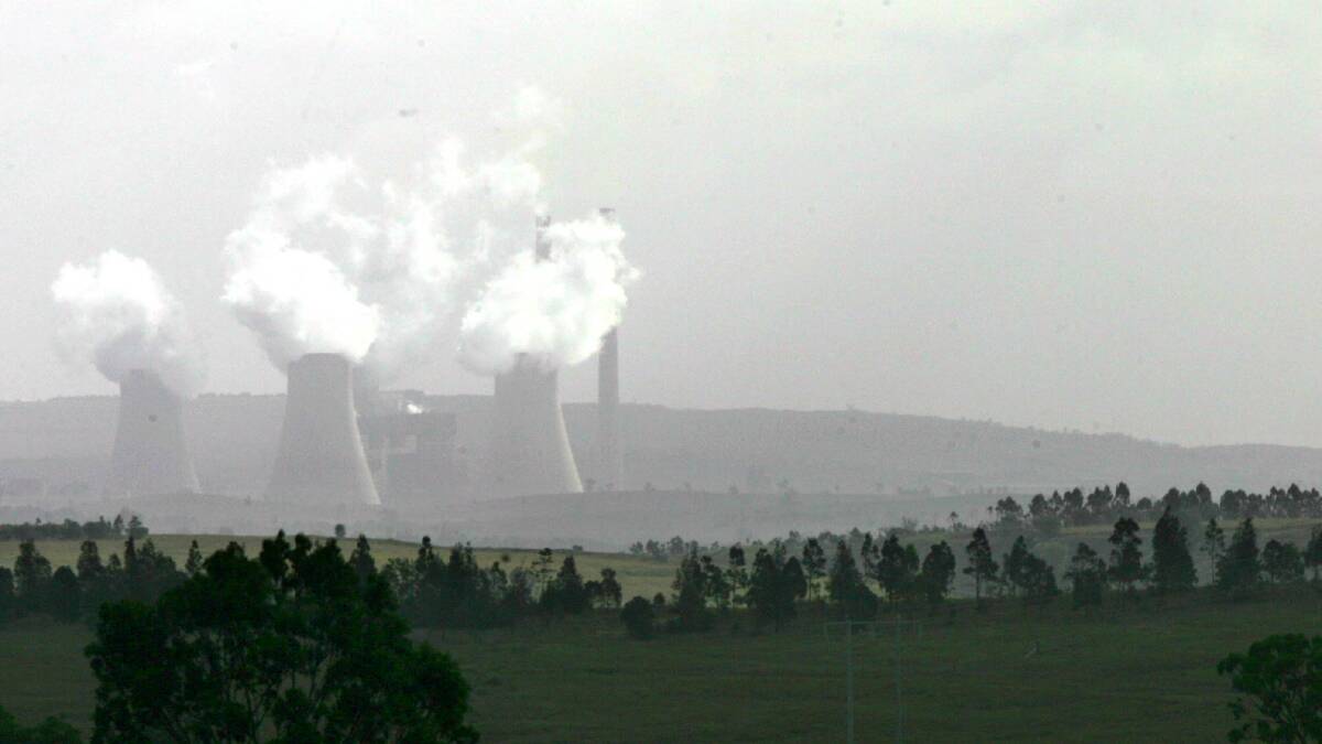 Dust shrouds Bayswater Power Station, near Singleton, in 2008. Picture: Kitty Hill 