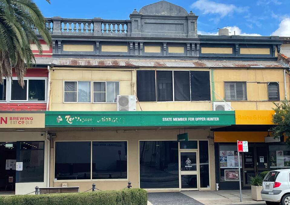 Michael Johnsen's name and photograph have been removed from his electorate office in Muswellbrook. 