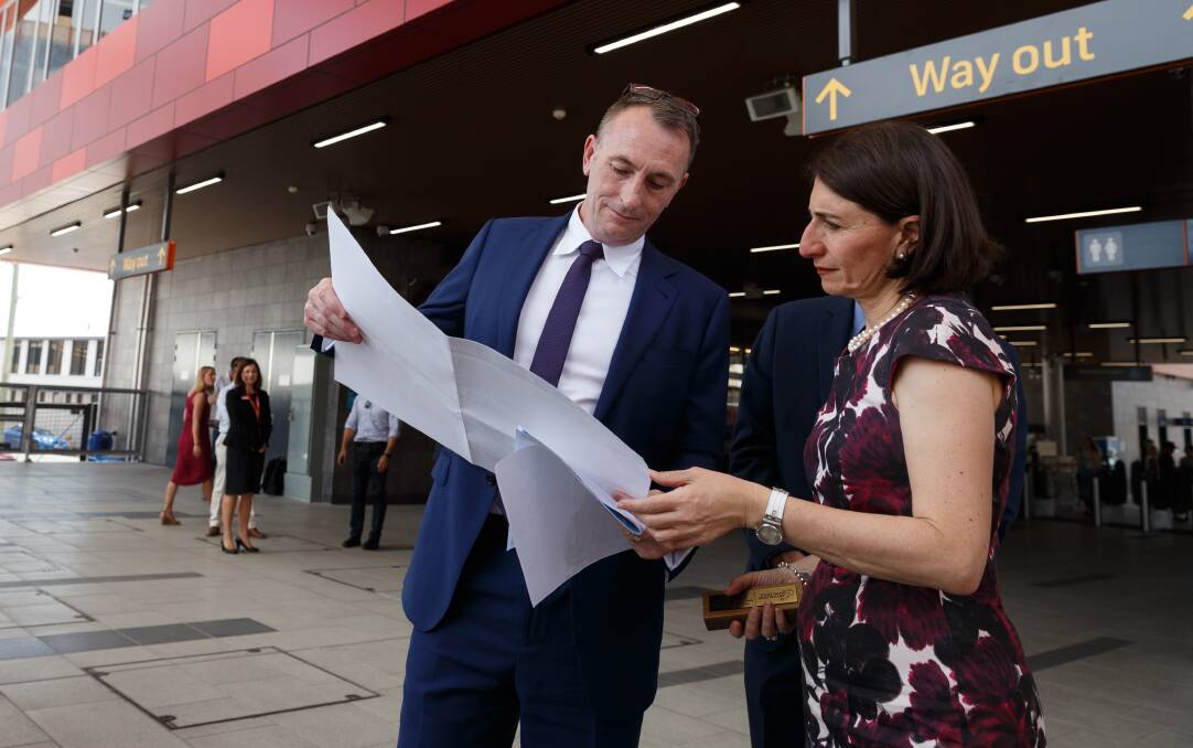 NEW JOB: Michael Cassel with Premier Gladys Berejiklian at the Newcastle transport interchange in 2017. Picture: Max Mason-Hubers