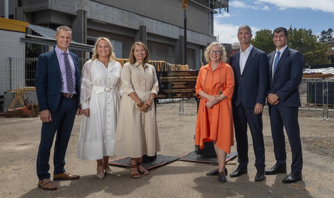 Tim Crakanthorp, Nuatali Nelmes, Newcastle Art Gallery Foundation chair Susan Galwey, Sharon Claydon, John Graham and Jeremy Bath unveil a foundation stone at the gallery on Tuesday. Picture by Marina Neil