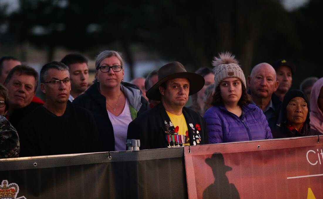 PAYING THEIR RESPECTS: The crowd at the Nobbys beach dawn service. Picture: Jonathan Carroll