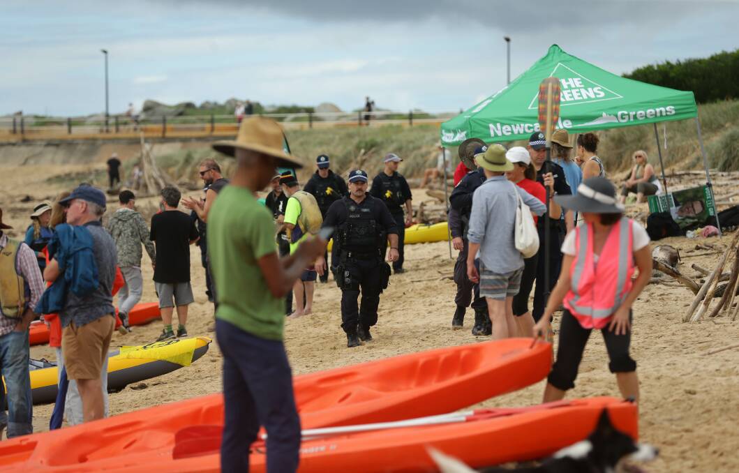 NO ARRESTS: Police on patrol as protesters launch kayaks off Horseshoe Beach. 