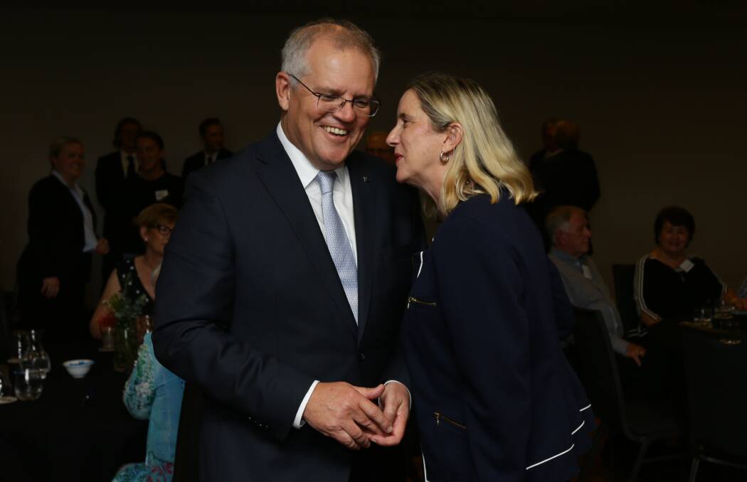 CLOSE ENCOUNTER: Liberal lord mayoral candidate Jenny Barrie with Scott Morrison at a party function at Kahibah on Monday. Picture: Jonathan Carroll