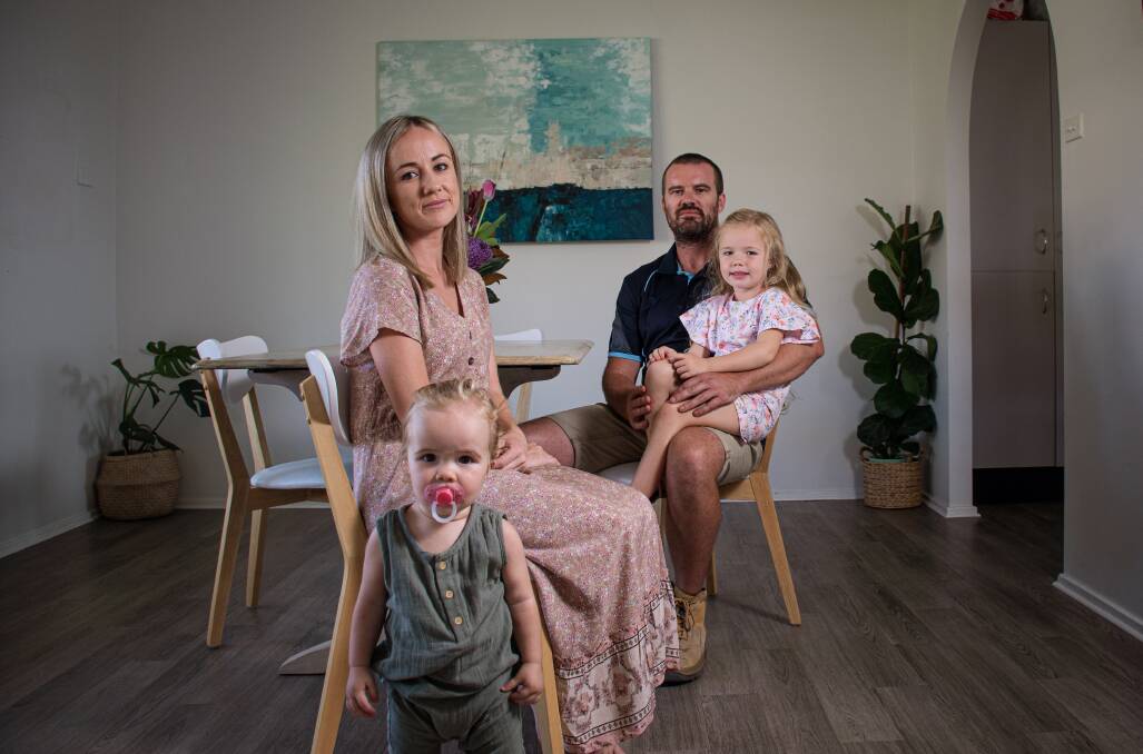 FINANCIAL STRAIN: Nat Meyers with wife Peta and daughters Audrey and Violet at their Macquarie Hills home on Friday. Peta has been diagnosed with Huntington's disease. Picture: Simon McCarthy 