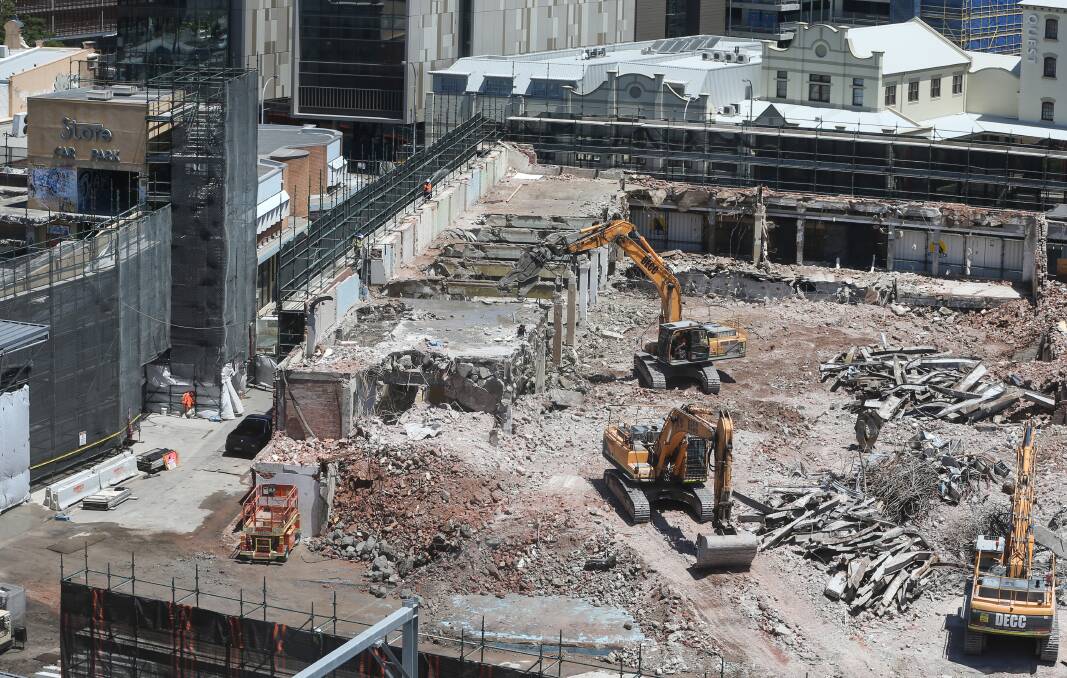 GONE: Excavators continue work on demolishing the Store building on Friday afternoon. It will make way for a five-storey car park as stage one of Doma's $200 million redevelopment. Picture: Marina Neil