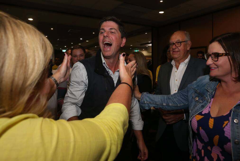 Upper Hunter candidate Jeff Layzell enters the Nationals' election party at Singleton Diggers on Saturday night. Picture: Simone De Peak