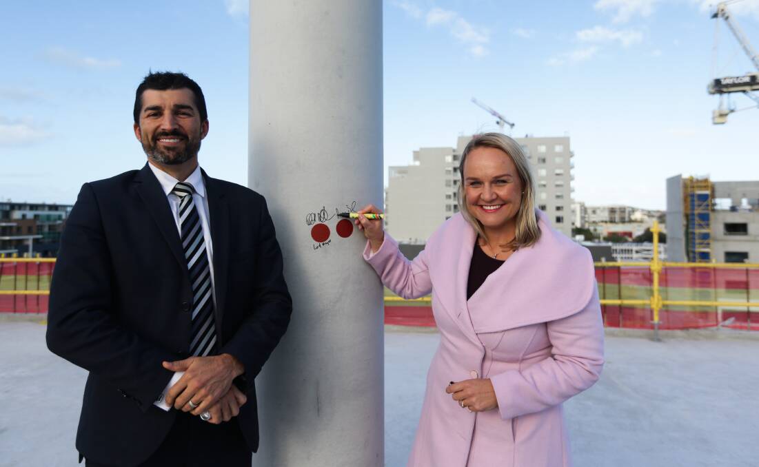 ON TOP OF THE WORLD: Chief executive officer Jeremy Bath and lord mayor Nuatali Nelmes at a ceremony on the roof of the council's new offices in June last year. 