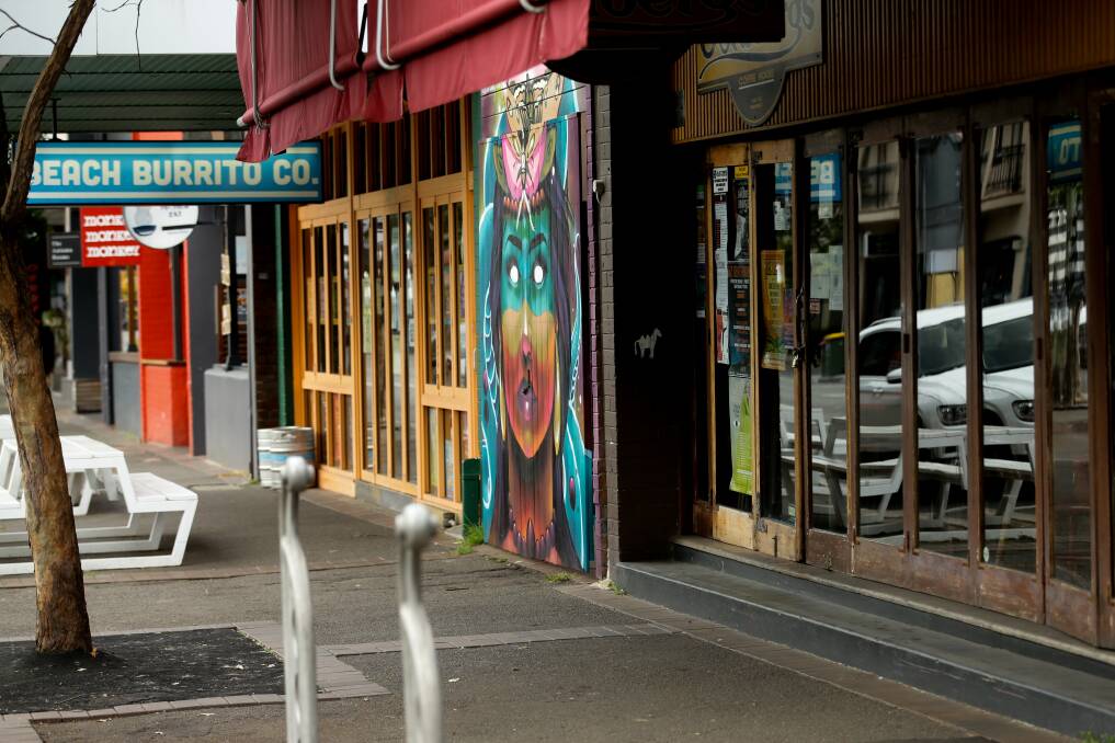 LOCKED UP: Shuttered cafes in Darby Street will remain closed for at least another two weeks. Picture: Jonathan Carroll