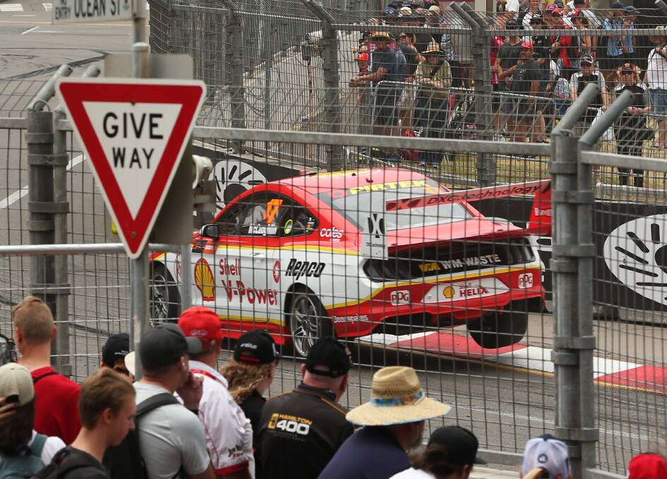 CHAMPION ELECT: The crowd lines Shortland Esplanade to watch Scott McLaughlin's Mustang in Newcastle 500 practice on Friday. Picture: Simone De Peak 