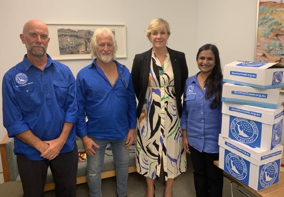 Save Our Coast directors Doug Kolysnck, Peter Morris and Natasha Deen deliver a 60,000-strong petition against seismic testing to independent MP Zali Steggall in Parliament House on Wednesday. Ms Steggall tabled the petition in parliament on Thursday 