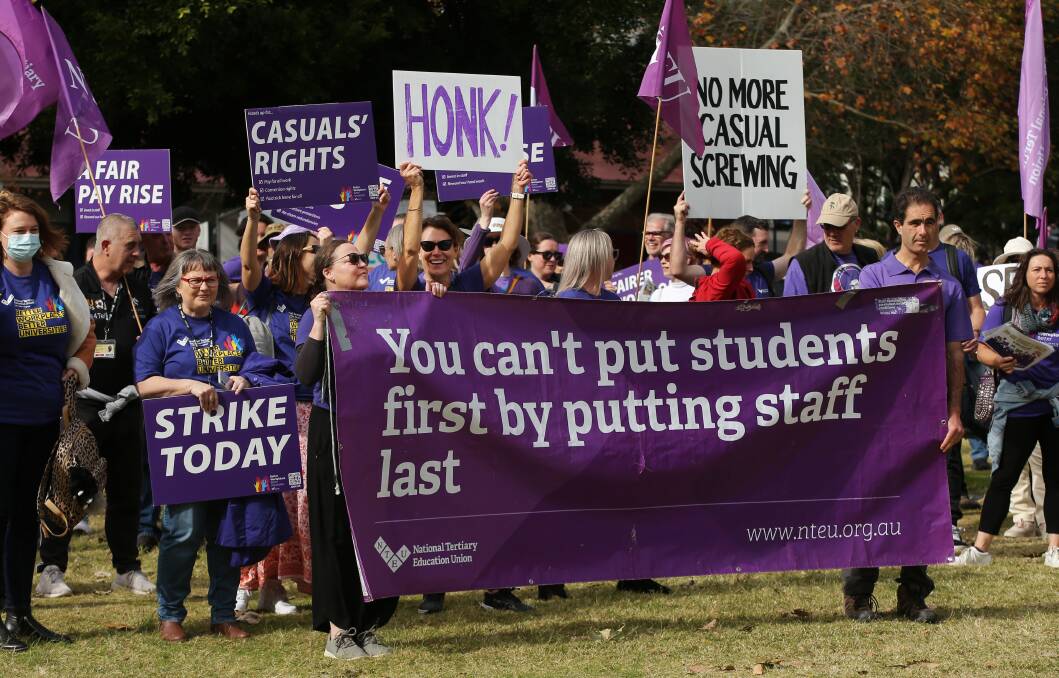 University of Newcastle staff rallying in Civic Park on Thursday as part of a 24-hour strike. Picture by Simone De Peak