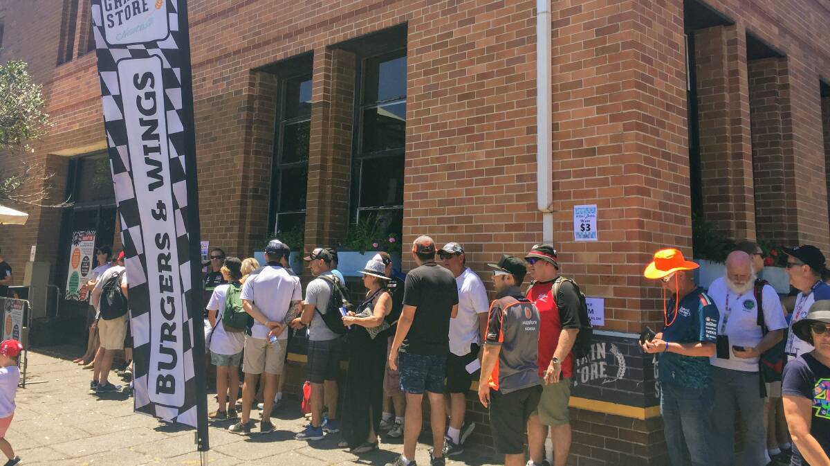 Customers queue outside the Grain Store in Scott Street during the Supercars weekend.