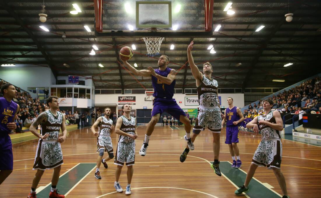 WHERE TO NEXT: NBA star Ben Simmons, left, playing for Louisiana State University at Newcastle Basketball Stadium in 2015. Picture: Jonathan Carroll
