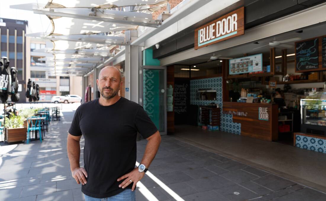 QUIET TIME: Peter James outside his Blue Door cafe in Hunter Street, which will close this weekend. Picture: Max Mason-Hubers