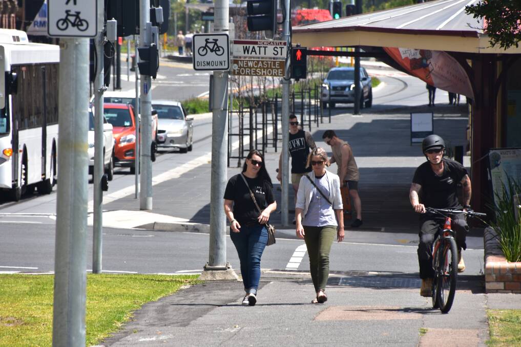 CHANGE OF DIRECTION: A cyclist shares the footpath with pedestrians in Scott Street on Wednesday after the government banned bikes from using the road. Picture: Max McKinney