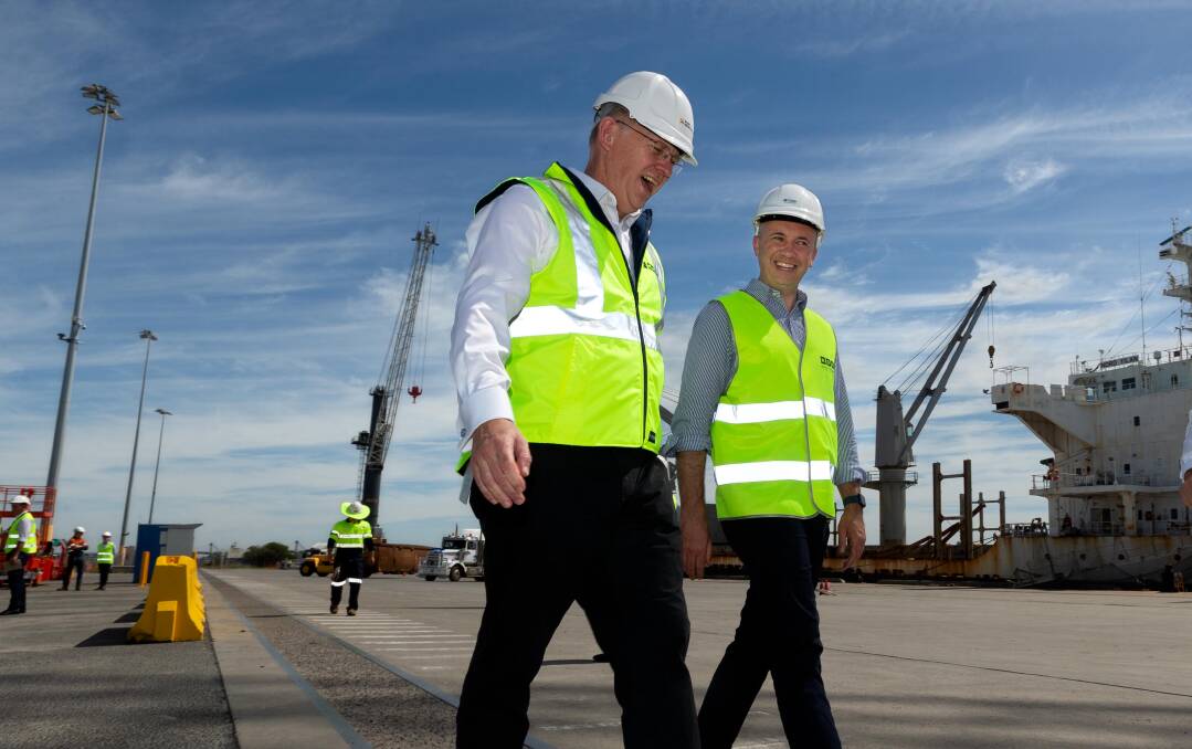 Matt Kean shares a joke with port chief executive Craig Carmody in Newcastle on Wednesday. Picture by Jonathan Carroll