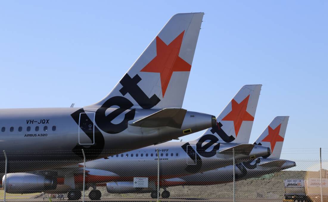 NOWHERE TO GO: Grounded Jetstar aircraft at Newcastle Airport in June. 